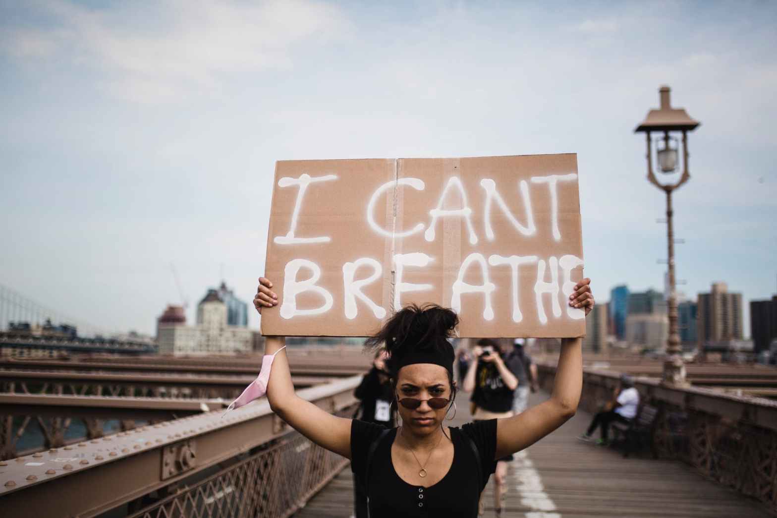 woman holding a sign in protest